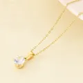 Classic stainless steel gold plated necklace with a single prong-set cubic zirconia pendant. - Single Stone Style / Gold Color (KN300980-KFC)