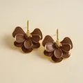 Detailed close-up shot of vintage brown enamel flower petal earrings with golden center - Silver Earring Post - Coffee