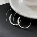 Detailed macro view of minimalist silver large hoop earrings with unique geometric design - Hook Style / Silver
