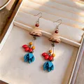 Close-up detail of ethnic wood earrings with blue flower pendants in a jewelry box - S / Ear Hook-Coffee-Red-Blue