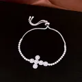 Detailed macro view of silver zircon cross pendant on an adjustable bolo bracelet. - Style 6 (WB1999) / Silver