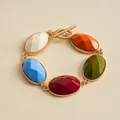 Vintage gold metal bracelet with colorful oval resin stones and toggle clasp detail - Colorful