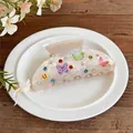 Detail of acrylic hair claw clip with colorful butterfly prints and rhinestones - White