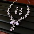 Detailed view of an elegant purple flower and leaf rhinestone necklace and earring set - Earrings-Necklace Set / Purple