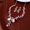 Detailed view of elegant pink crystal flower and leaf necklace and earring jewelry set - Earrings-Necklace Set / Pink