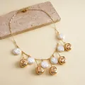 Detailed view of vintage gold metallic wrinkled bead and white pearl fringe necklace - Necklace / White Eco-Friendly Pearl / Gold