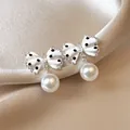 Elegant close-up of polka dot bow earrings with white pearls and rhinestones on satin. - Silver-White Polka Dot