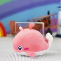 Detail view of a cute pink whale plush toy pendant with embroidered features - Pink