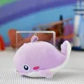 Close-up of a cute purple plush whale keychain pendant with soft fabric details. - Purple