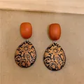 Vintage teardrop wooden earrings with black floral patterns and orange oval studs - Coffee-Black