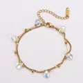 Detailed view of gold double-layer stainless steel bracelet with iridescent charms - 17+5cm / Rainbow Water Drop (Bead Style 2)
