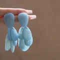 Detailed macro view of blue marbled teardrop tassel earrings with resin marble texture - Silver (Silver Pin) / Blue