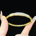 Detailed view of an 18K gold-plated bangle bracelet with pave-set shimmering zircons - Classic Micro-Inlaid Style (11#)