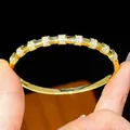 Close-up of 18K gold plated bangle bracelet with pavé-set cubic zirconia - Rectangular Module Style (7#)