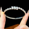 Macro detail of 18K gold plated buckle bangle with shimmering cubic zirconia stones - Geometric Brilliant Style (6#)