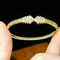Detailed macro view of 18K gold plated bangle featuring sparkling cubic zirconia stones - V-Shape Chevron Style (3#)