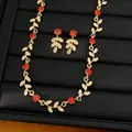 Detail of gold-plated necklace and earrings set with red and white flower leaf design - Necklace + Earrings Set / Gold-Red