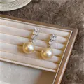 Elegant gold pearl stud earrings with sparkling cubic zirconia presented in jewelry box - Silver Post Rectangular Zirconia Style / Silver