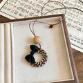 Vintage woven ring pendant necklace featuring a black bow and natural wooden bead. - Bow Woven Ring Style (5项链-咖色-黑色)