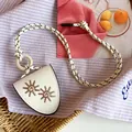Close-up detail of niche leather necklace with sun flower embroidery and rope cord - Sunflower Glasses Holder Style / Necklace-White