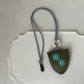 Handcrafted leather sunburst pendant necklace featuring a chic bicolor cord and boho design - Black White and Dark Green Necklace