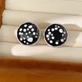 Detailed view of round polka dot glass stud earrings with silver needles in jewelry box - Round Polka Dot Stud Earrings (HE35650) / Black
