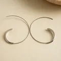Close-up shot of minimalist silver C-shaped geometric ear hooks with a sleek metal finish - Earring Hooks / Silver