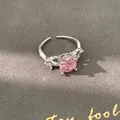 Macro detail of silver ring with a round pink zircon and marquise clear stones - Adjustable Open Ring / Silver-Pink