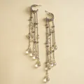 Close-up detail of long silver tassel earrings featuring clear faceted glass teardrop beads - Silver Pin Water Drop Tassel Style / Silver