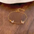 Elegant 14K gold plated butterfly bracelet with cubic zirconia and pink inlay - Gold