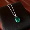 Elegant silver chain necklace featuring a large oval emerald-green zircon gemstone pendant - Necklace / Silver/Green
