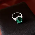 Light luxury silver ring with an oval green zircon gemstone and pear-cut side accents - Ring / Silver/Green