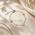Bracciale in acciaio al titanio argento con ciondoli in cristallo e numeri romani - Bracciale / Argento
