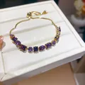Detail view of an 18k gold plated bracelet with sparkling purple geometric zircon stones - Purple Geometric Style (9#)
