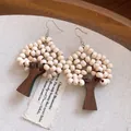 Close-up of tree-shaped earrings crafted with wooden beads and dark wood trunks - Tree Shaped Wood Bead Style (12#) / Coffee-White (12#)