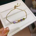 Close-up of 18k gold plated bracelet with colorful sparkling cubic zirconia stones. - Gold Horizontal Rainbow Style (2#)