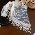 Detail view of white floral lace mesh waist scarf with elegant fringe tassels - Lace Mesh Waist Scarf / White