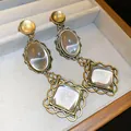 Elegant vintage gold-tone dangle earrings with oval and square clear glass cabochons - Vintage Lace Ear Dangle (HE35673) / Silver Needle Gold Transparent