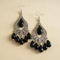Detail shot of gothic-style teardrop earrings with black acrylic beads and silver-tone engraving. - Hook-Silver-Black