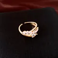 Close-up detail of 18k gold plated open ring with sparkling cubic zirconia stones - Open Ring / Gold