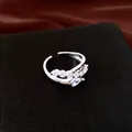 Macro view of elegant 18k gold plated open ring with sparkling cubic zirconias - Open Ring / Silver