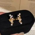Clips d'oreilles dorés en forme d'étoile avec zircone étincelante sans piercing - Or