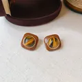Close-up of retro Maillard style resin stud earrings with tiger eye stone center - Round Ball Style (5#) / Gold with Coffee