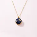 Gold stainless steel locket necklace featuring a blue celestial moon and star enamel charm - Sapphire Space / Gold