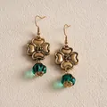 Detailed close-up view of vintage gold flower earrings with emerald green resin beads. - Earrings / Antique Gold-Emerald Green