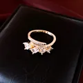 Detailed view of pear-cut zircon stones on a rose gold plated open ring - Gold
