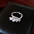 Macro view of an elegant silver open ring featuring four pear-cut cubic zirconia stones - Silver