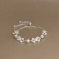 Silbernes verstellbares Perlenarmband mit funkelnden Schmetterlings-Kristallen - Schleifenform Zirkonia Verstellbarer Stil (59) / Silber-Lavendel
