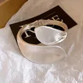 Detailed close-up of a heavy-duty silver twisted bangle with overlapping leaf design - Matte Style (4#)