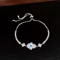 Bracelet ajustable en argent avec breloque main de Fatma et œil protecteur sertis de zircons. - Argent-Fleur